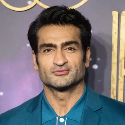 Kumail Nanjiani tapered clipper cut with sideburns