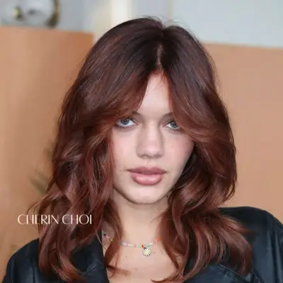 Chocolate cherry-colored hair.