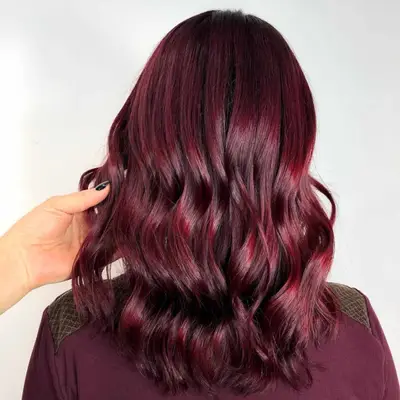 Chocolate cherry-colored hair.
