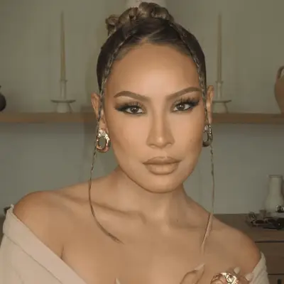 desi perkins wearing bun with braided pieces in the front