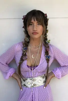 woman with butterfly clips in her braids