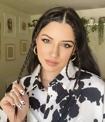 Face framing braids by Justine Marjan