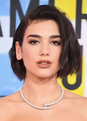 Dua Lipa tousled, side-parted bob