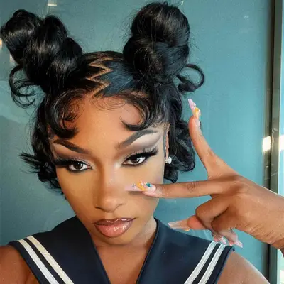 Megan Thee Stallion with high space buns 