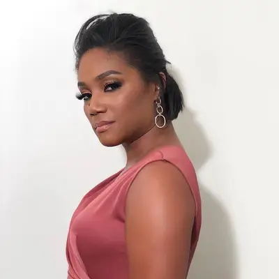 Tiffany Haddish with short half up hairstyle 