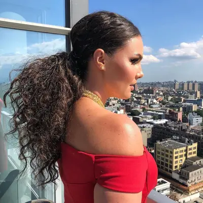Candice Huffine with textured low ponytail 