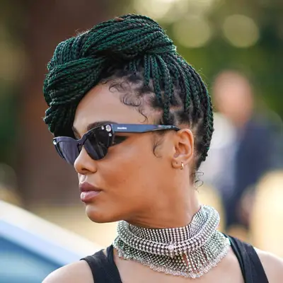 Tessa Thompson with a box braid top knot 