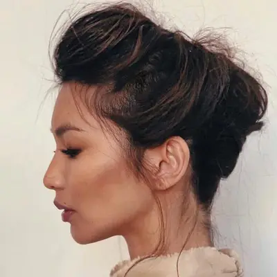 Gemma Chan with pinned up updo