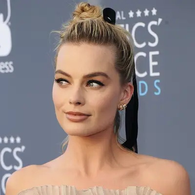 Margot Robbie with off-center bow updo 