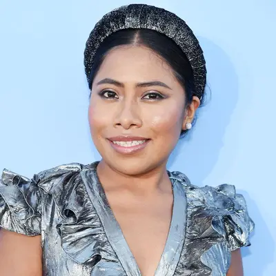 Yalitza Aparicio with chunky headband updo 