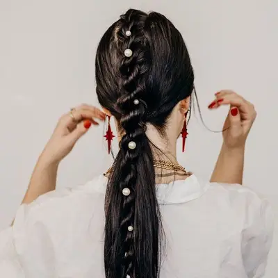 Braided center part ponytail 