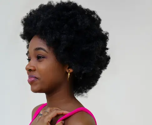 Close up of a woman with afro hair