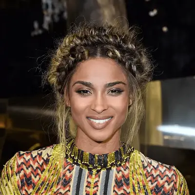 Vanessa Hudgens wearing a blonde crown braid on the red carpet