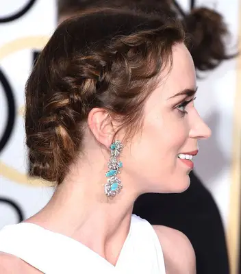 Emily Blunt wearing a French braid around her head on the red carpet
