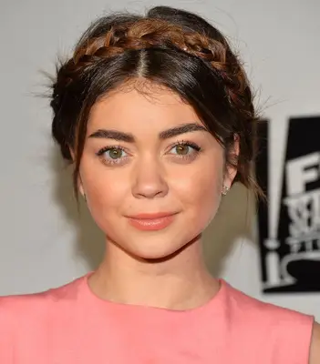 Sarah Hyland wearing a milkmaid braid on the red carpet