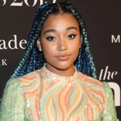 Actor Storm Reid with her hair in boho braids in a ponytail