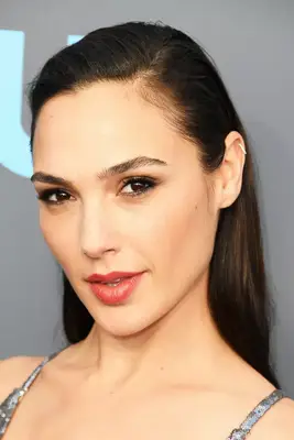 Gal Galdot wears her in a straight, sleekly brushed back hairstyle
