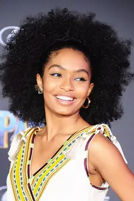 Yara Shahidi wears her hair in an afro style to a Black Panther event