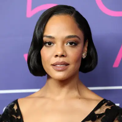 Close up of actor Tessa Thompson with a blunt, slightly bent bob haircut