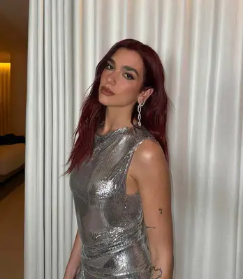 Dua Lipa with pop star red hair