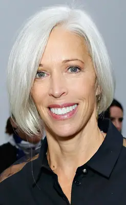 Linda Fargo with an asymmetrical gray straight bob hairstyle