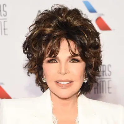 Carole Bayer Sager in white suit with teased, layerd bob