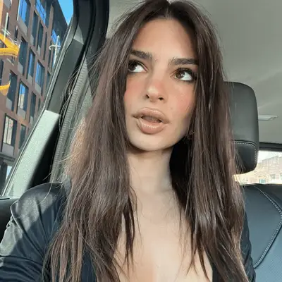 Maya Jama with long, straight hair with bangs and ghost layers