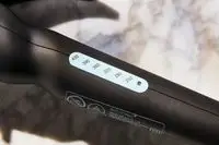 A close-up of the temperature settings of the Bio Ionic Long Barrel Curling Iron