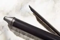 a close-up of the clamp on the Bio Ionic Long Barrel Curling Iron