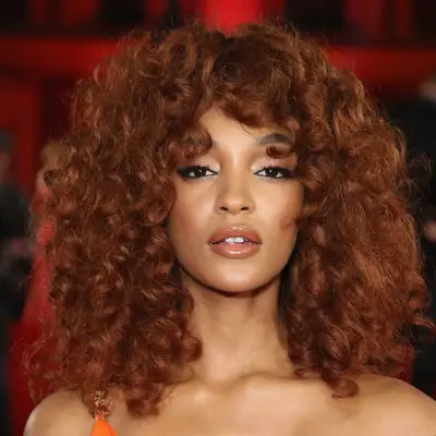 Jourdan Dunn wearing dark copper curls