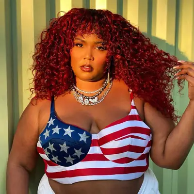 Lizzo wearing Electric red curls