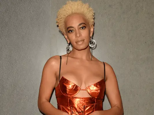 solange wearing light blonde curls
