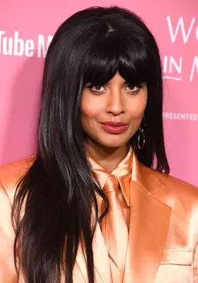 Jameela Jamil voluminous shag haircut and heavy curtain bang