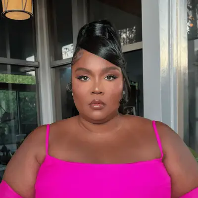 Brunette with mid-length hair in braid