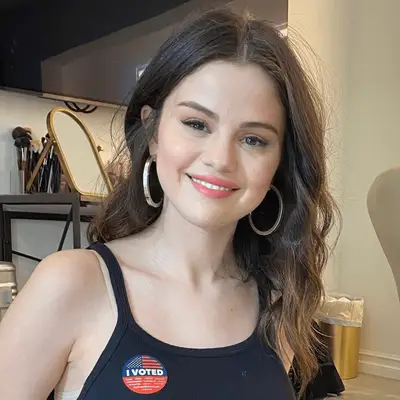 Gemma Chan with messy low chignon