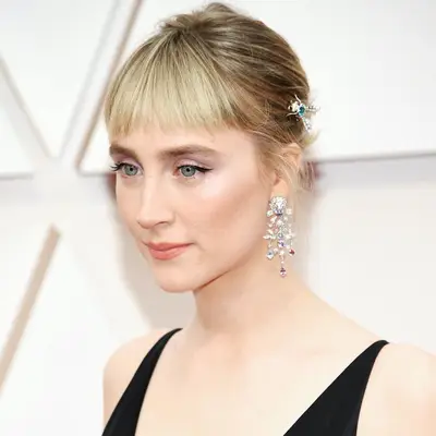 Saoirse Ronan with updo and bangs with insect hair accessory