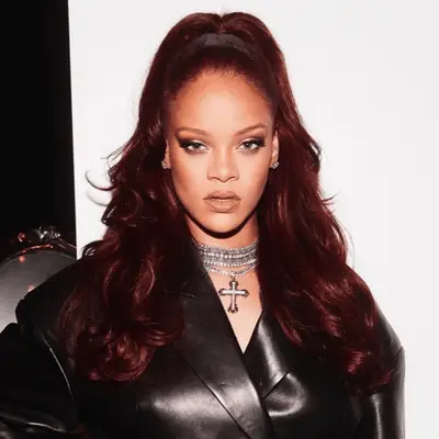 Ciara with medium-length hair in textured topknot