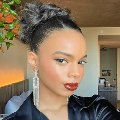 Imaan Hammam with voluminous mid-length curls