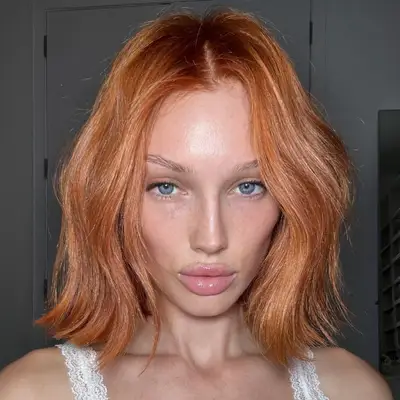 Phoebe Dynevor with copper hair
