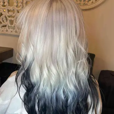 Woman with white to black reverse ombré hair