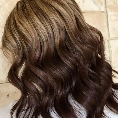 Woman with light to dark brown reverse ombré hair