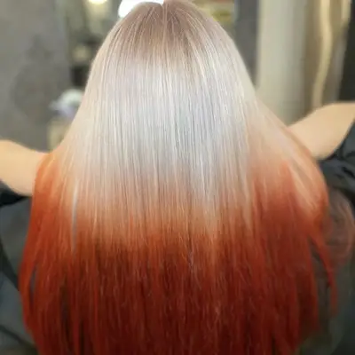 Platinum to red reverse ombré hair
