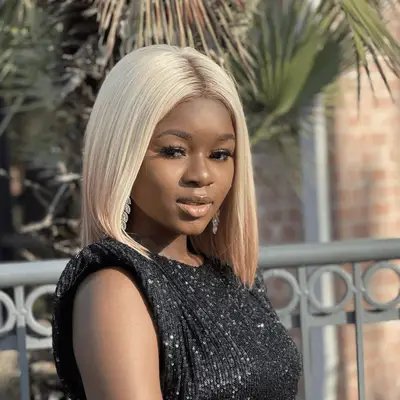 Woman with blonde to red reverse ombré hair