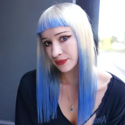 Woman with blonde to purple reverse ombre hair