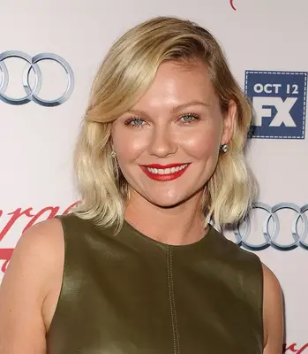 Kirsten Dunst with a side swept lob haircut