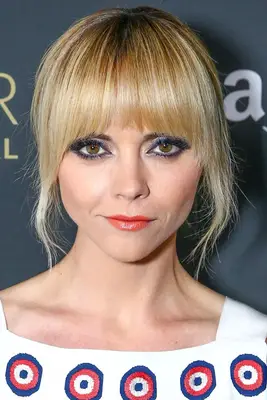 Christina Ricci blonde updo with full bangs