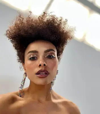 Kat Graham with a natural, sculpted short hairdo