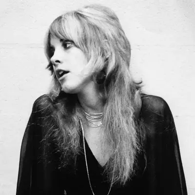 Stevie Nicks wears a long shag haircut in 1975