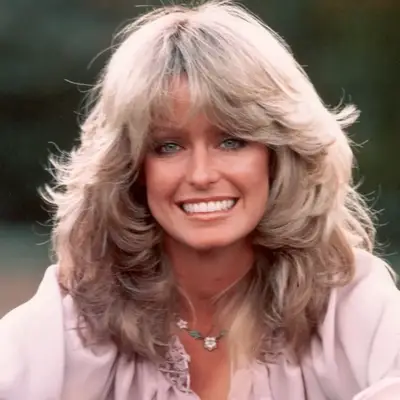Farrah Fawcett wears her signature feathered 