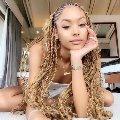 Blonde goddess braids with curly accents left out